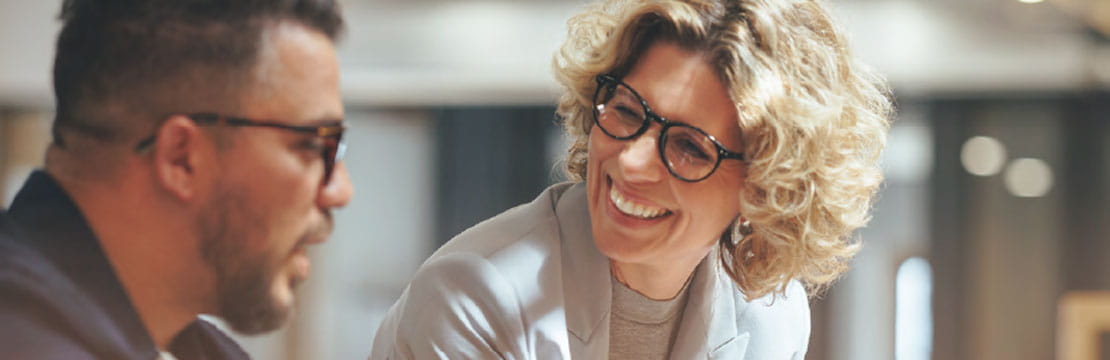 Smiling female financial advisor, attorney lawyer or bank manager consulting client investor